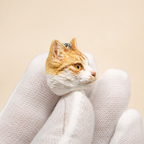 Custom orange and white cat clay necklace pendant, side profile