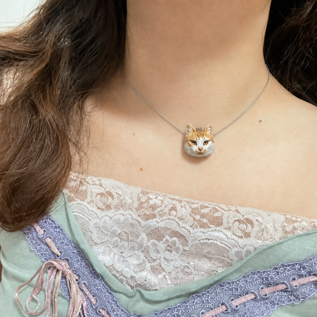 Custom pet portrait clay necklace worn by a model