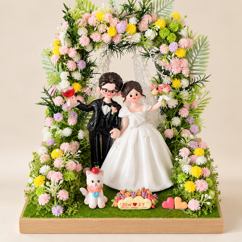 Custom bride and groom clay figurines under a pastel garden flower arch — design example